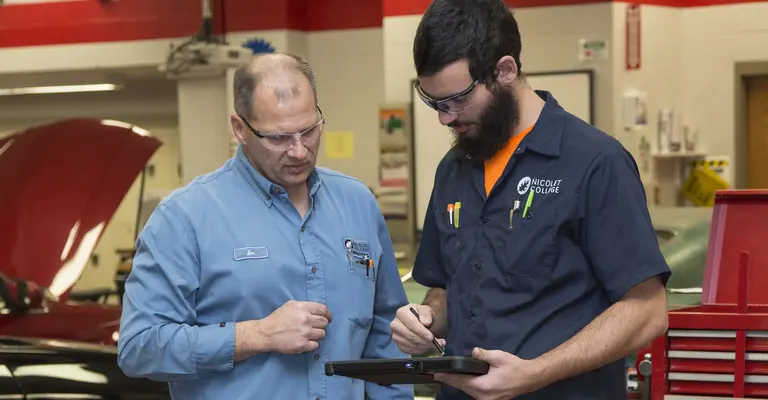 Auto instructor with student