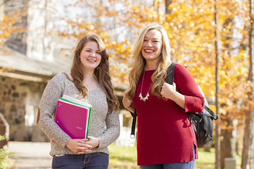 students in front of building