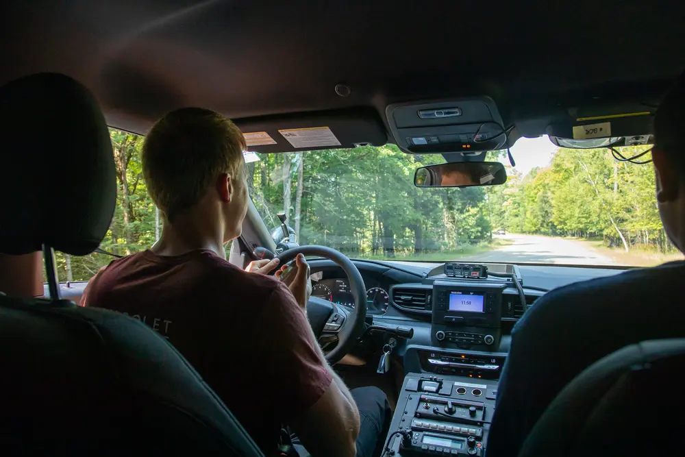 Criminal Justice student in squad car.