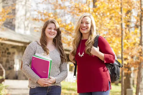 students in front of building